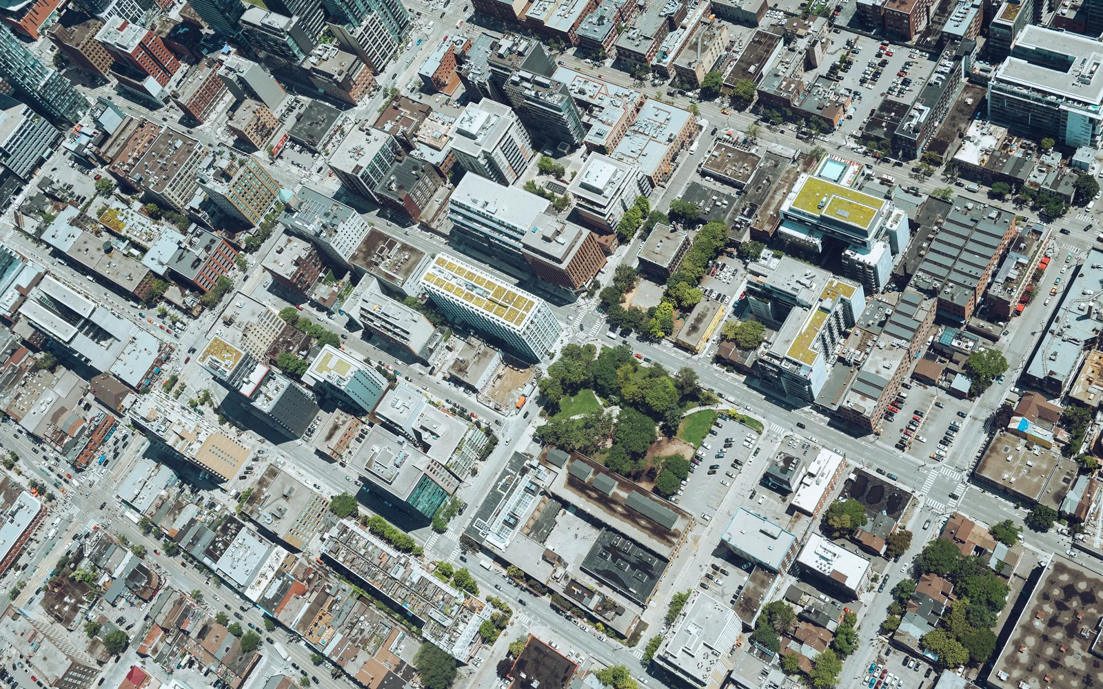 Aerial view of modern city buildings and streets.